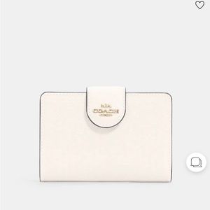 New and never used medium coach wallet